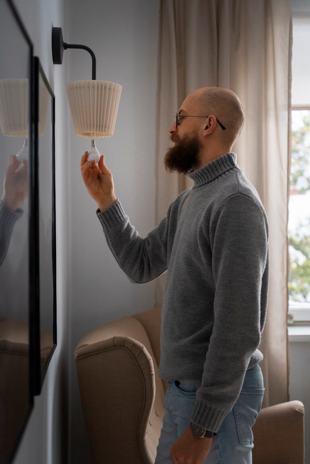 Man Turning Off Light Bulb Energy Crisis_23